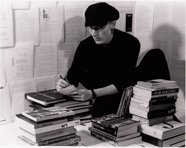 Billy, surrounded by books